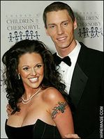 Anna Benson with husband Kris Benson showing cleavage